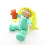 Cabbage Patch Kids girl in pajamas with teddy bear