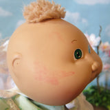 Cabbage Patch Kids Preemie girl doll with red mark on side of face
