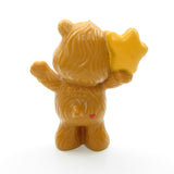 Tenderheart Bear listening to a friendly star miniature figurine