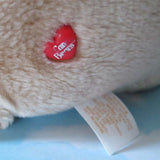 Care Bears red heart button with worn logo