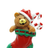 Teddy bear in Santa hat and Christmas stocking