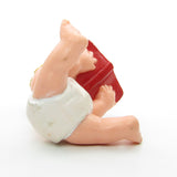 Magic Diaper Babies figurine with baby reading book