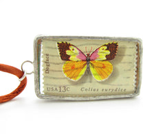 Dogface butterfly postage stamp in pendant