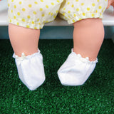 White doll booties with pale yellow bow