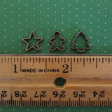 Dollhouse miniature star, gingerbread boy, and Christmas tree cookie cutters