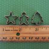 Miniature star, gingerbread boy, and tree cookie cutters
