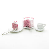 Miniature dollhouse tea set with cake and silverware