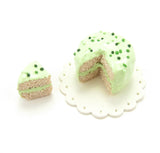 Green Frosted Cake with Sprinkles
