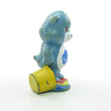 Care Bears Grumpy Bear spilling a colorful rainbow miniature figurine