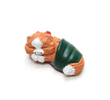 Orange kitten in green slipper figurine