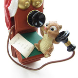 Chipmunk talking on old fashioned telephone ornament