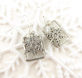 Silver snowflake charms on stained glass earrings