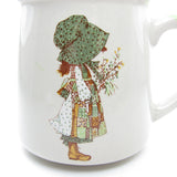 Holly Hobbie earthenware mug with green trim