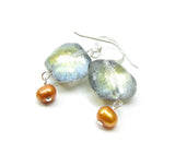 These glass pillow beads are iridescent on one side and translucent on the other for lots of sparkle and shine.