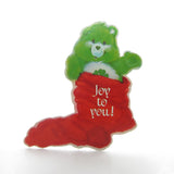 Joy to you Good Luck Bear in red Christmas stocking
