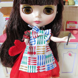 Blythe cooking apron with bow, oven mitt, and wooden spoon