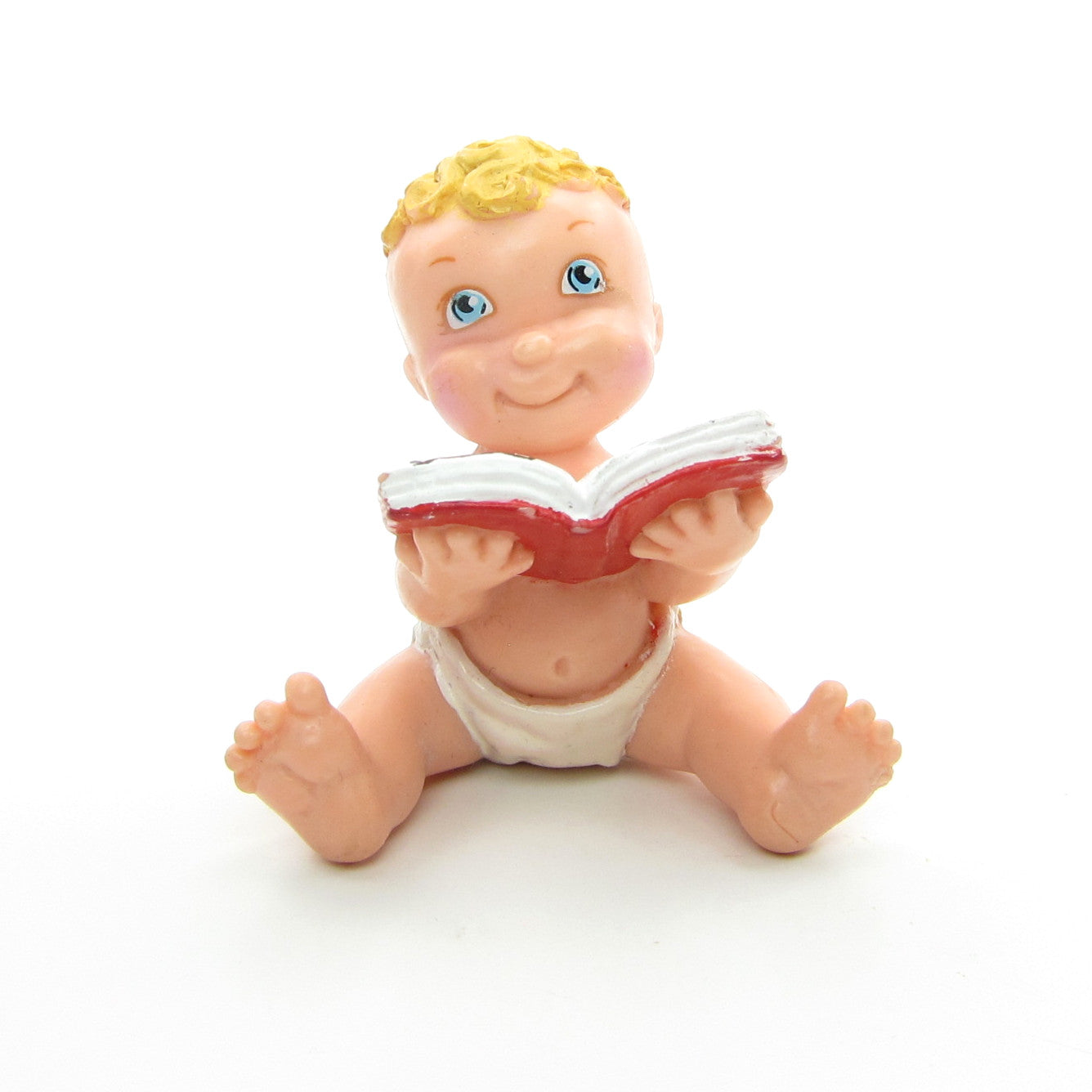 Magic Diaper Babies figurine with baby reading book