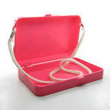 Vintage Poochie pink plastic carry case with white rope strap