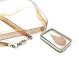 Soldered glass pendant with pressed red maple leaf