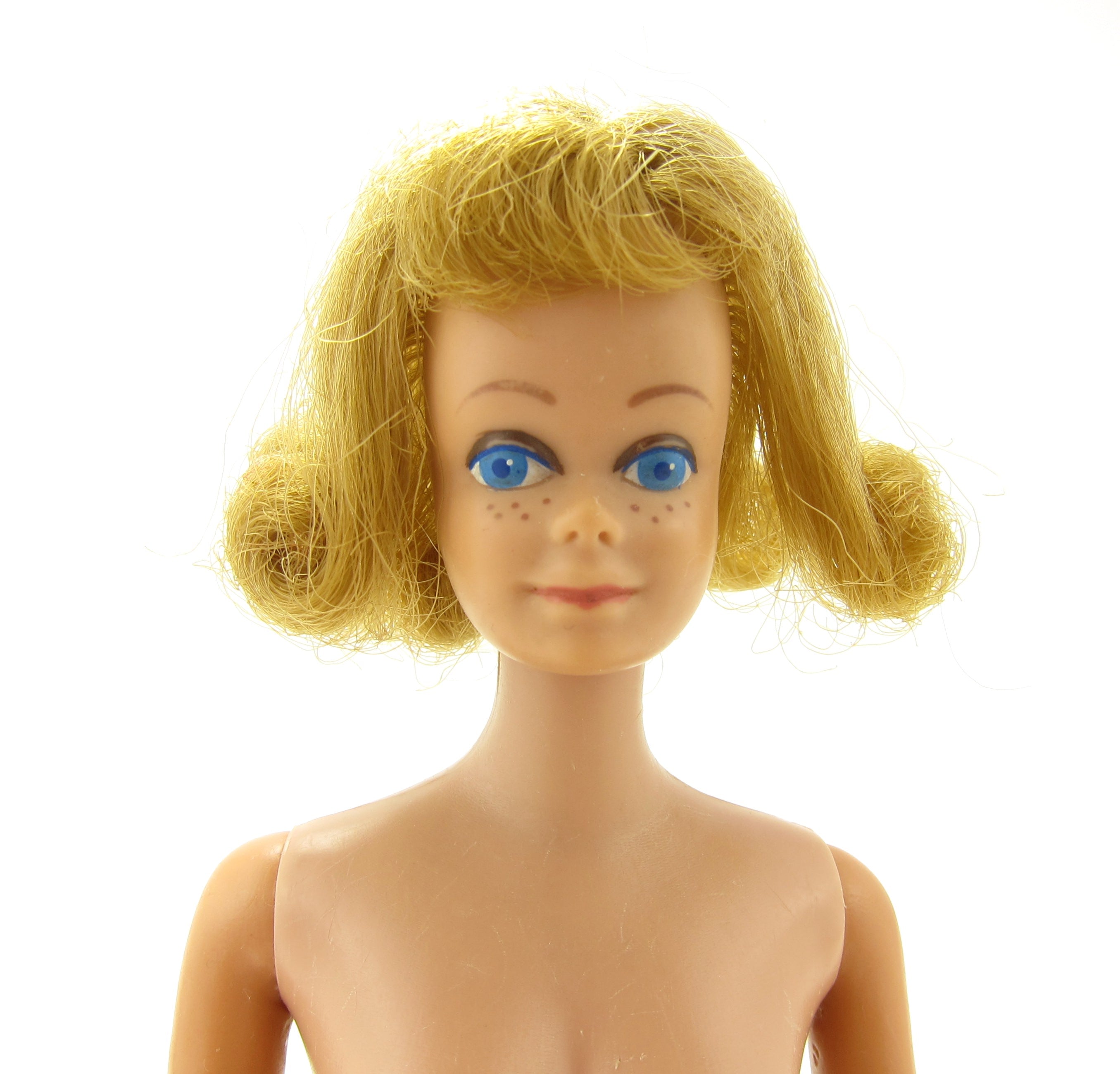 Vintage 1962 Midge doll with blonde hair, blue eyes, freckles