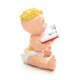 Magic Diaper Babies figurine with baby reading book