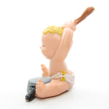 Magic Diaper Babies miniature figurine baby banging on pot or pan with spoon