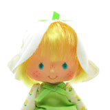 Mint Tulip Strawberry Shortcake doll with yellow hair and white hat