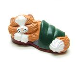 Orange kitten in green slipper figurine