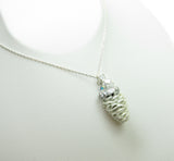 Sterling silver necklace with white pine cone charm