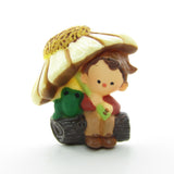 Pixie boy under daisy flower umbrella Hallmark lapel pin