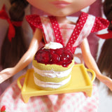 Polymer clay miniature strawberry shortcake with strawberries and whipped topping