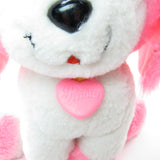 Poochie plush toy with pink heart collar