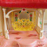 Yellow porch swing on Strawberry Shortcake Berry Happy Home dollhouse
