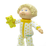 Blonde Cabbage Patch Kids boy in pajamas with teddy bear poseable toy