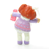 Cabbage Patch Kids poseable figure girl with red hair and purple dress