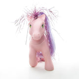 Princess Dawn pony with tuft of purple tinsel hair