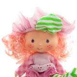 Raspberry Tart Strawberry Shortcake doll with pink curly hair