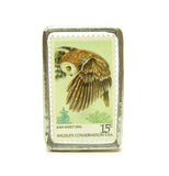 Vintage postage stamp in soldered glass pin