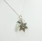 Snowflake and white pine cone charm necklace