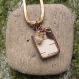 Soldered glass pendant with birch bark and leaves
