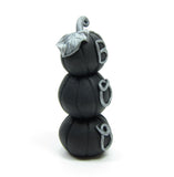 Miniature stack of black polymer clay pumpkins