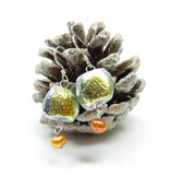 Yellow orange freshwater pearls dangle from the bottom of these autumn frost earrings