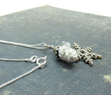 Sterling silver necklace with pinecone and snowflake