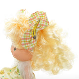 Banana Twirl Strawberry Shortcake Berrykin doll with banana hair bow