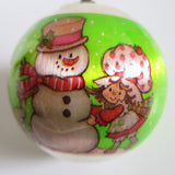 Strawberry Shortcake building a snowman Christmas ornament