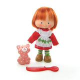 Vintage Strawberry Shortcake doll with Custard cat pet and red berry comb