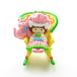 Strawberry Shortcake in a rocking chair miniature figurine