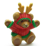 Christmas teddy bear in sweater with reindeer antlers