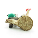 Tree stump mailbox ornament with red bird on branch