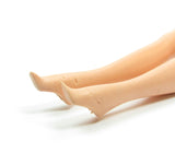 Barbie doll with indentations on feet